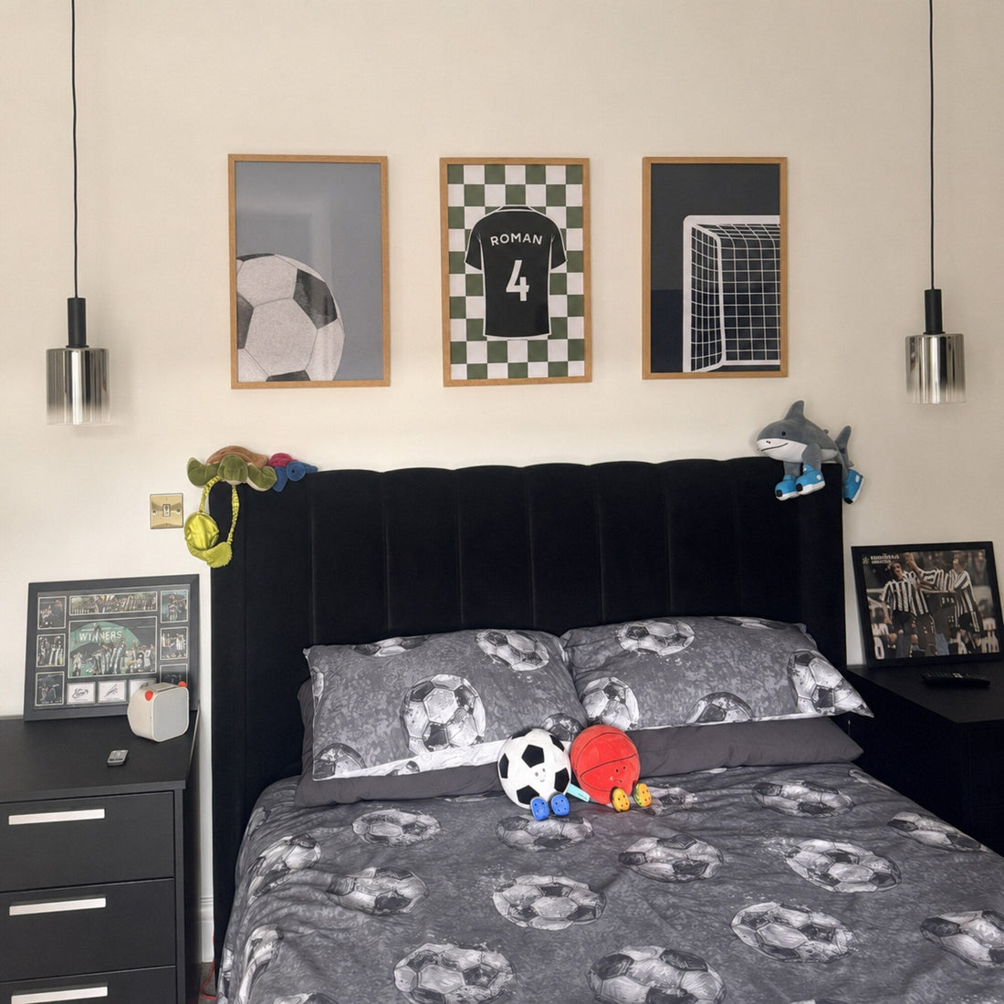 Personalised football gallery wall above a boy's bed with three framed football prints