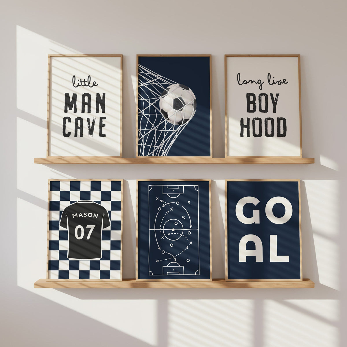 Navy football gallery wall with six personalised boys’ bedroom prints