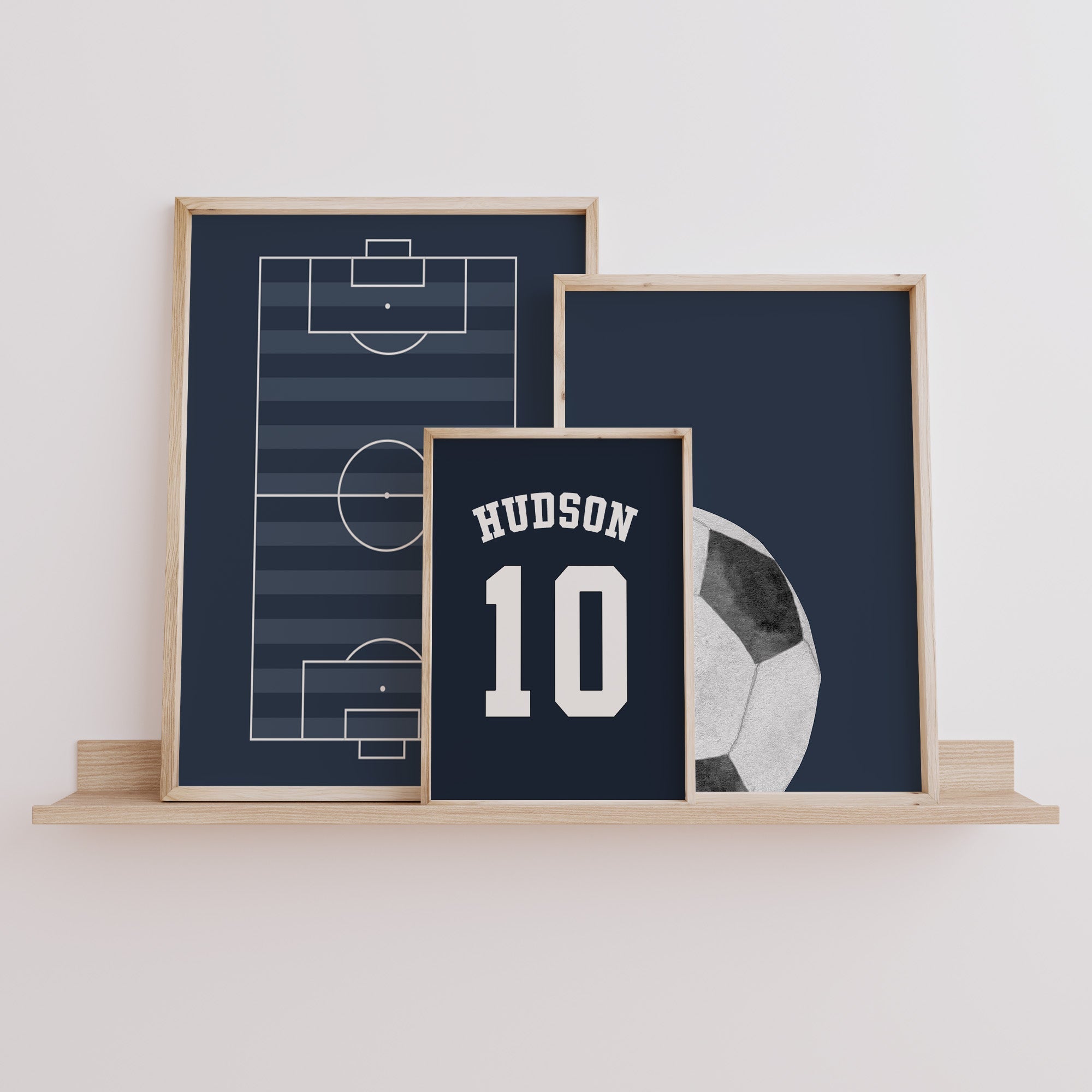 Personalised Football Pitch Prints Set of 3, Navy Wall Art shown in a styled room